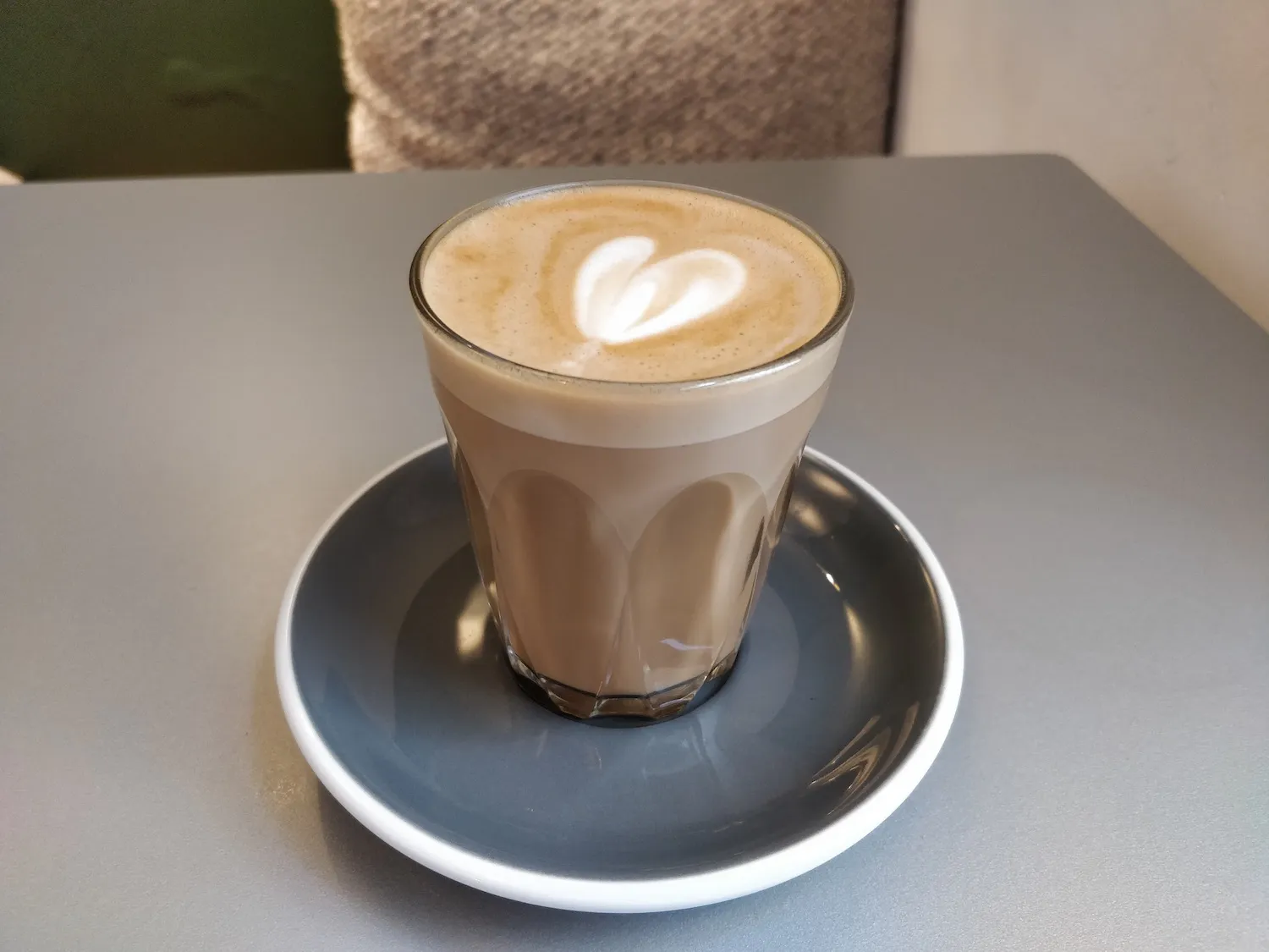 Flat White on table at at HJEM coffee shop in London.